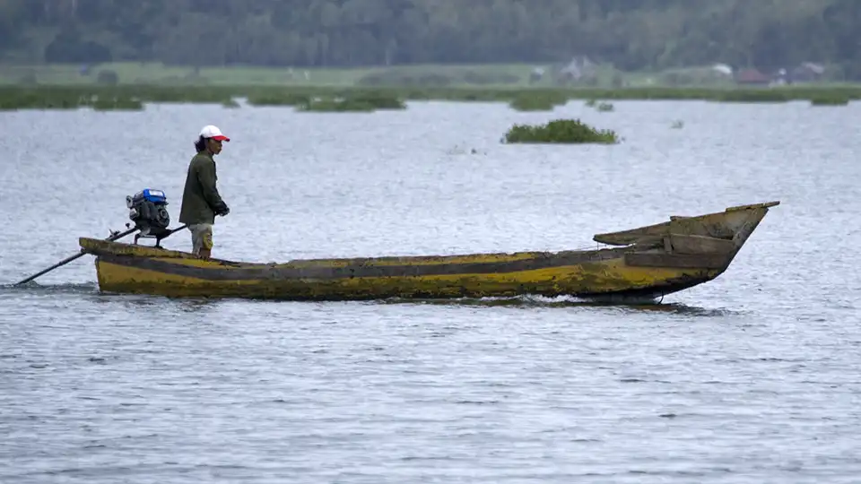 Fisherman and Canoe on Lake Tondano